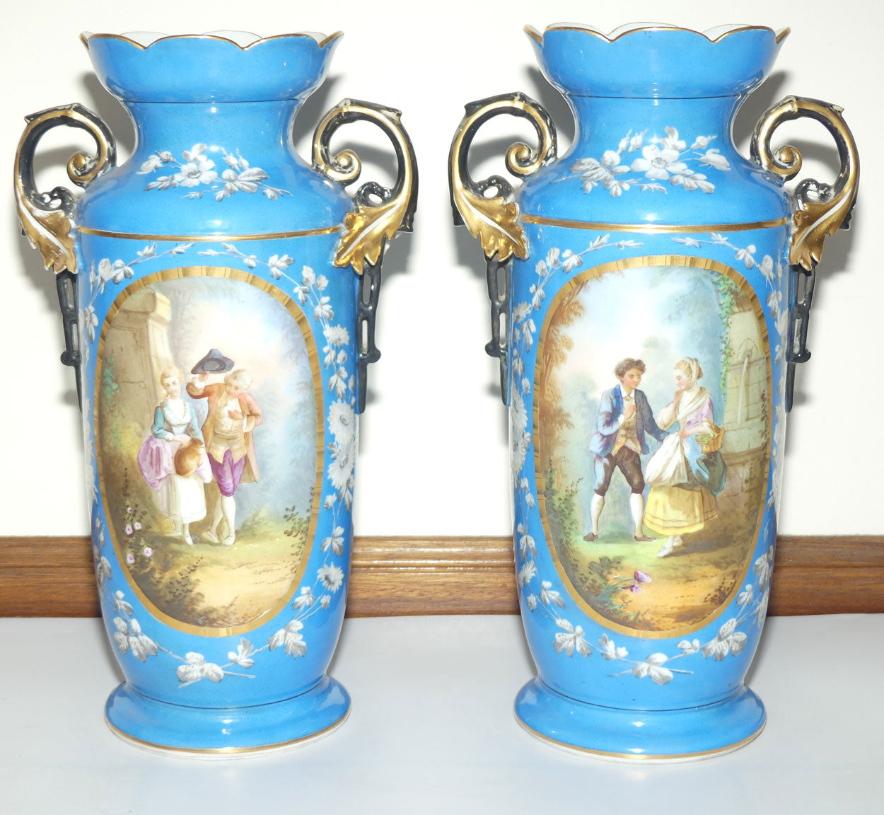 Pair of Continental European mantle vases with courting couple scenes c.1890