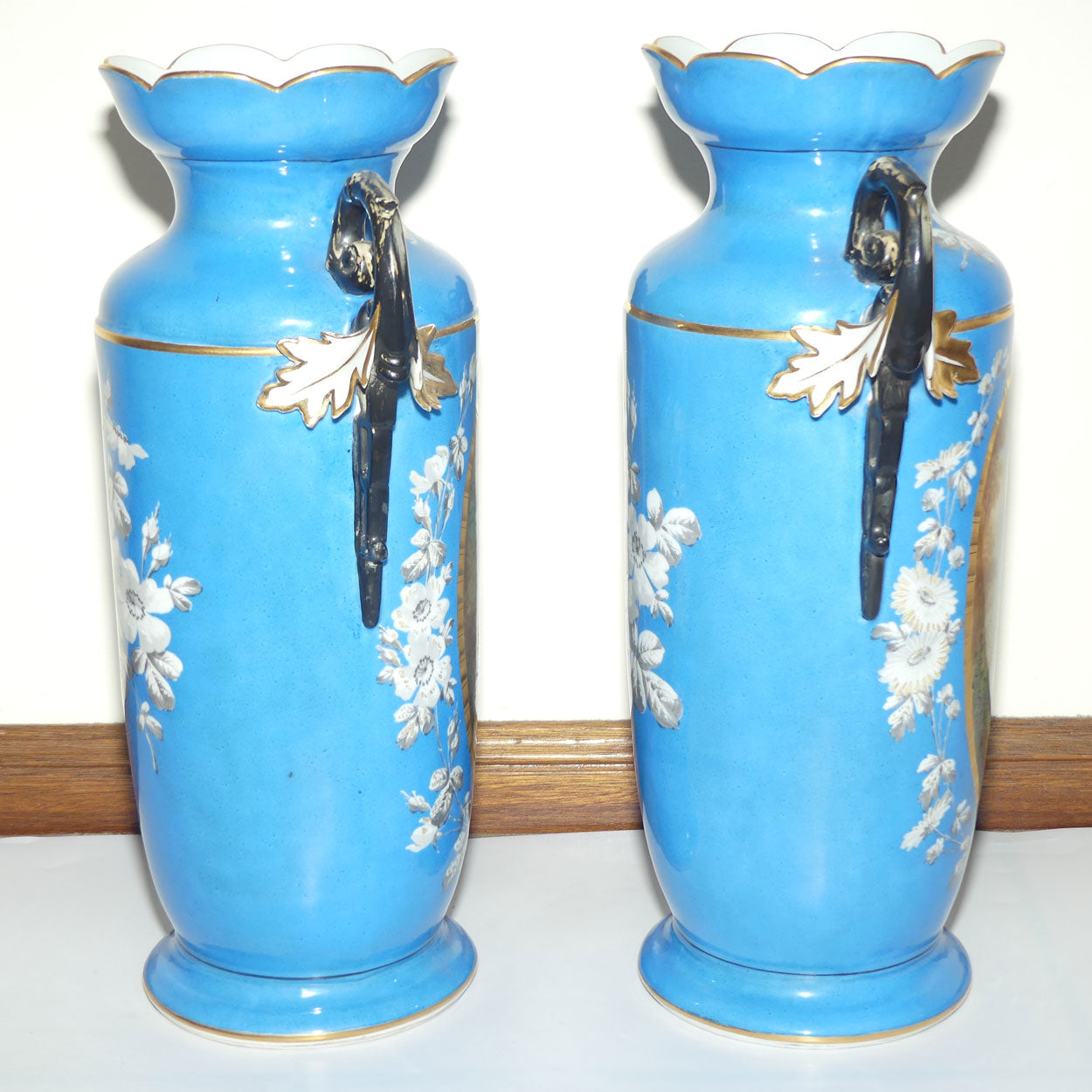 Pair of Continental European mantle vases with courting couple scenes c.1890