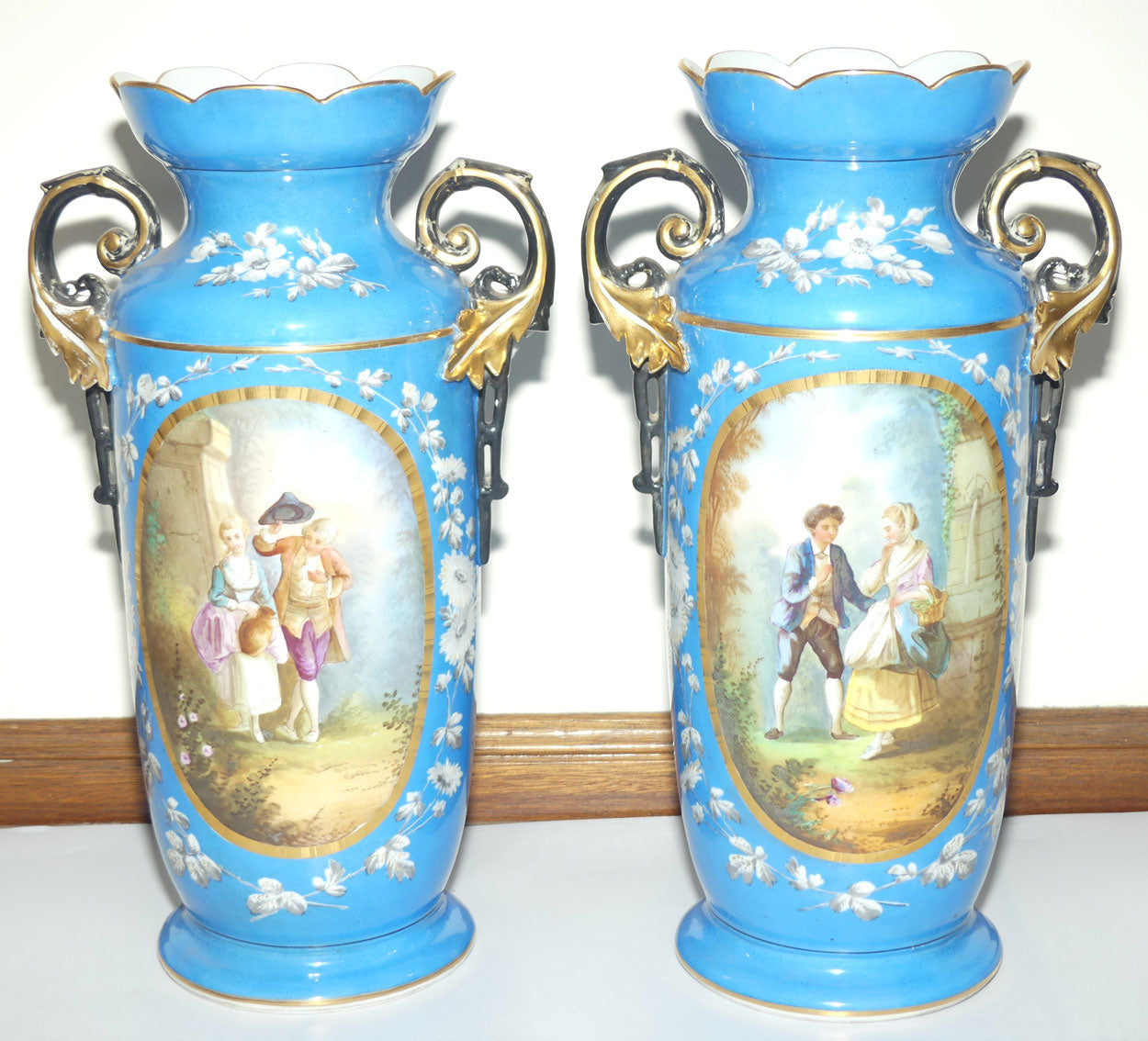 Pair of Continental European mantle vases with courting couple scenes c.1890