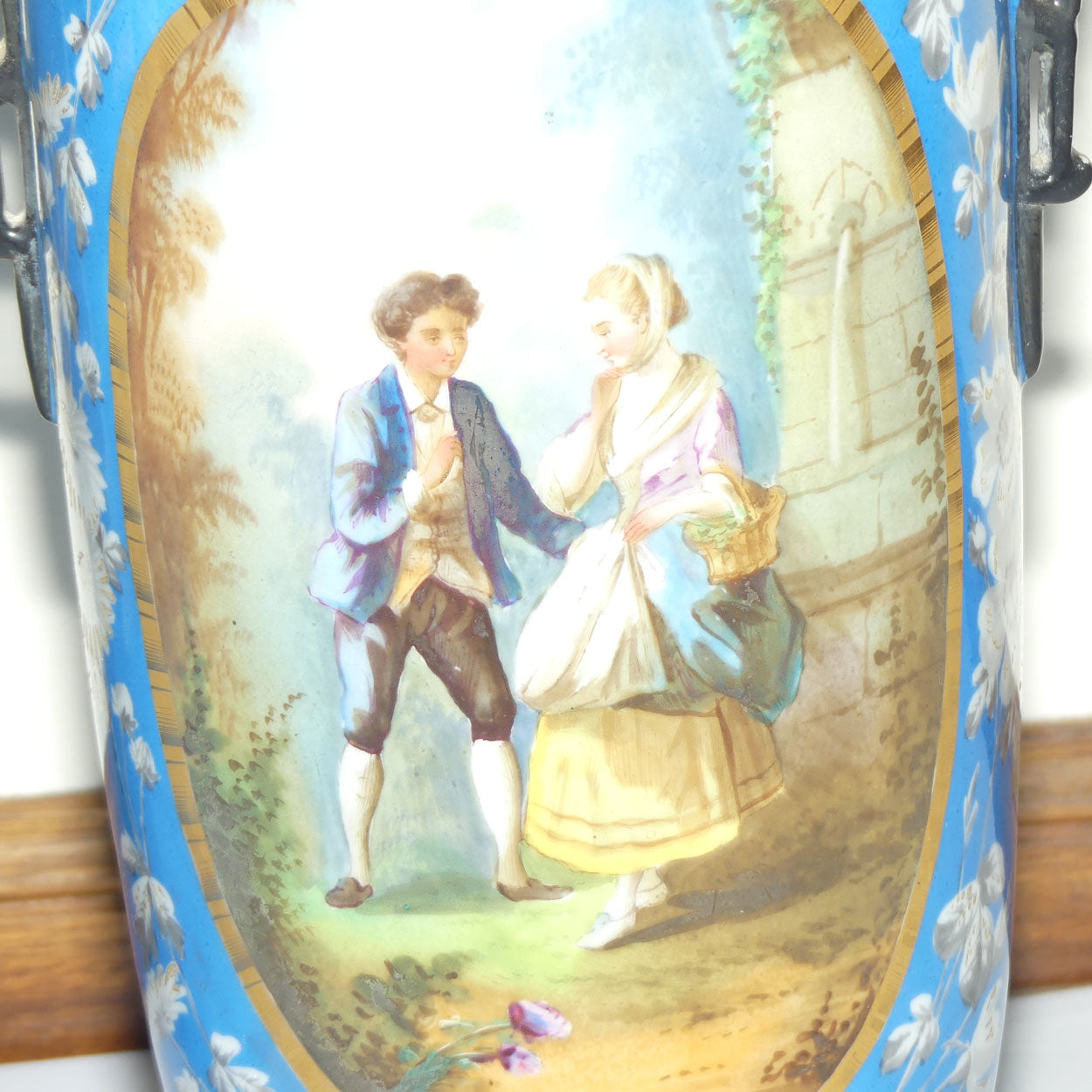 Pair of Continental European mantle vases with courting couple scenes c.1890
