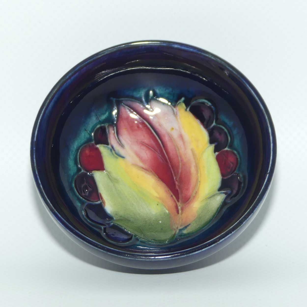 Walter Moorcroft Leaf and Fruit with Blue ground miniature footed bowl | 7.9cm diam