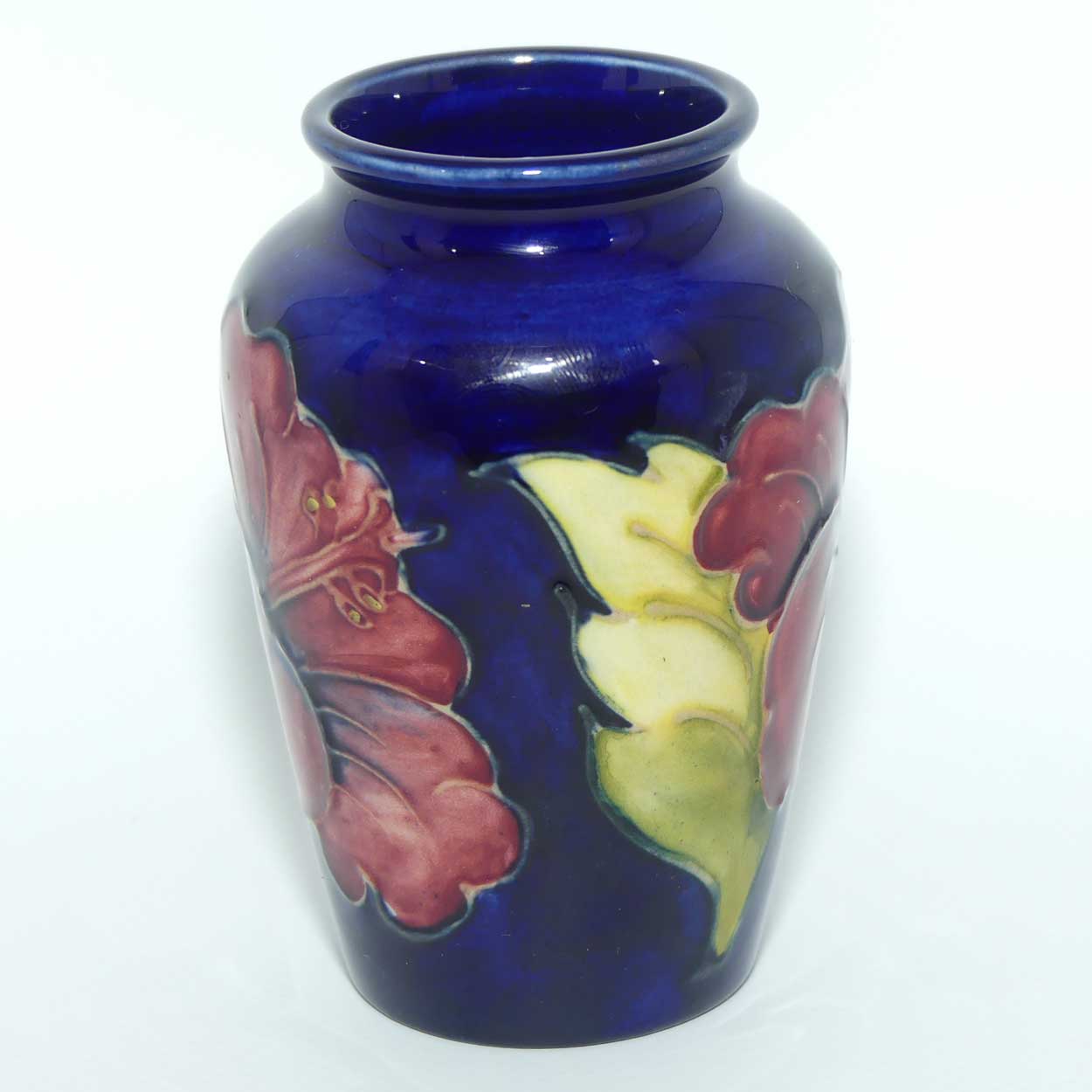 Walter Moorcroft Hibiscus on Blue ground small vase | Original Paper Label to base
