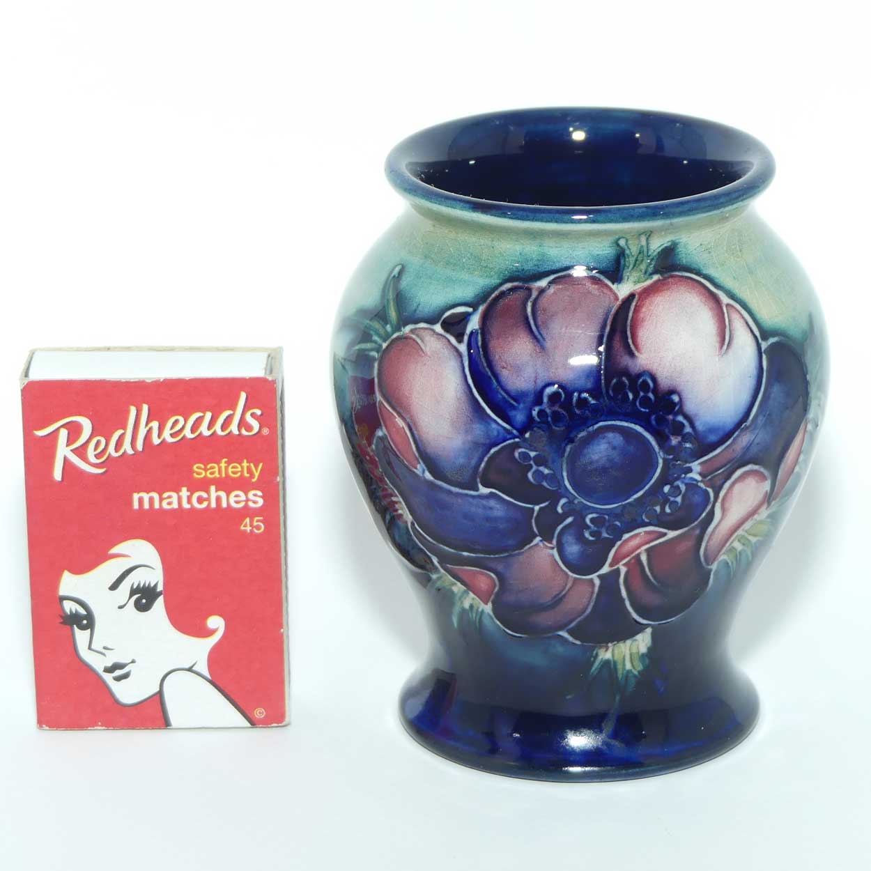 Walter Moorcroft Anemone on Green to Blue ground miniature vase