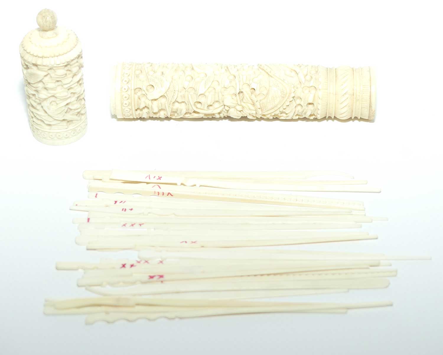 Chinese Carved Ivory needle case containing numerous counters