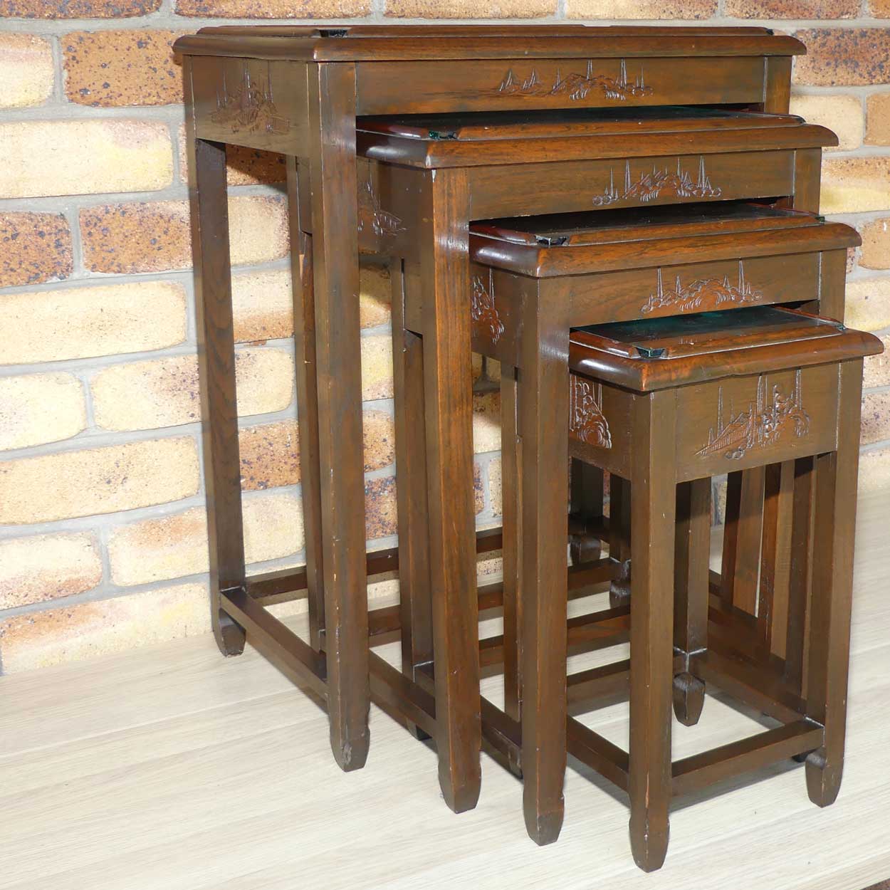 Chinese Carved Nest of 4 Occasional tables with Glass tops