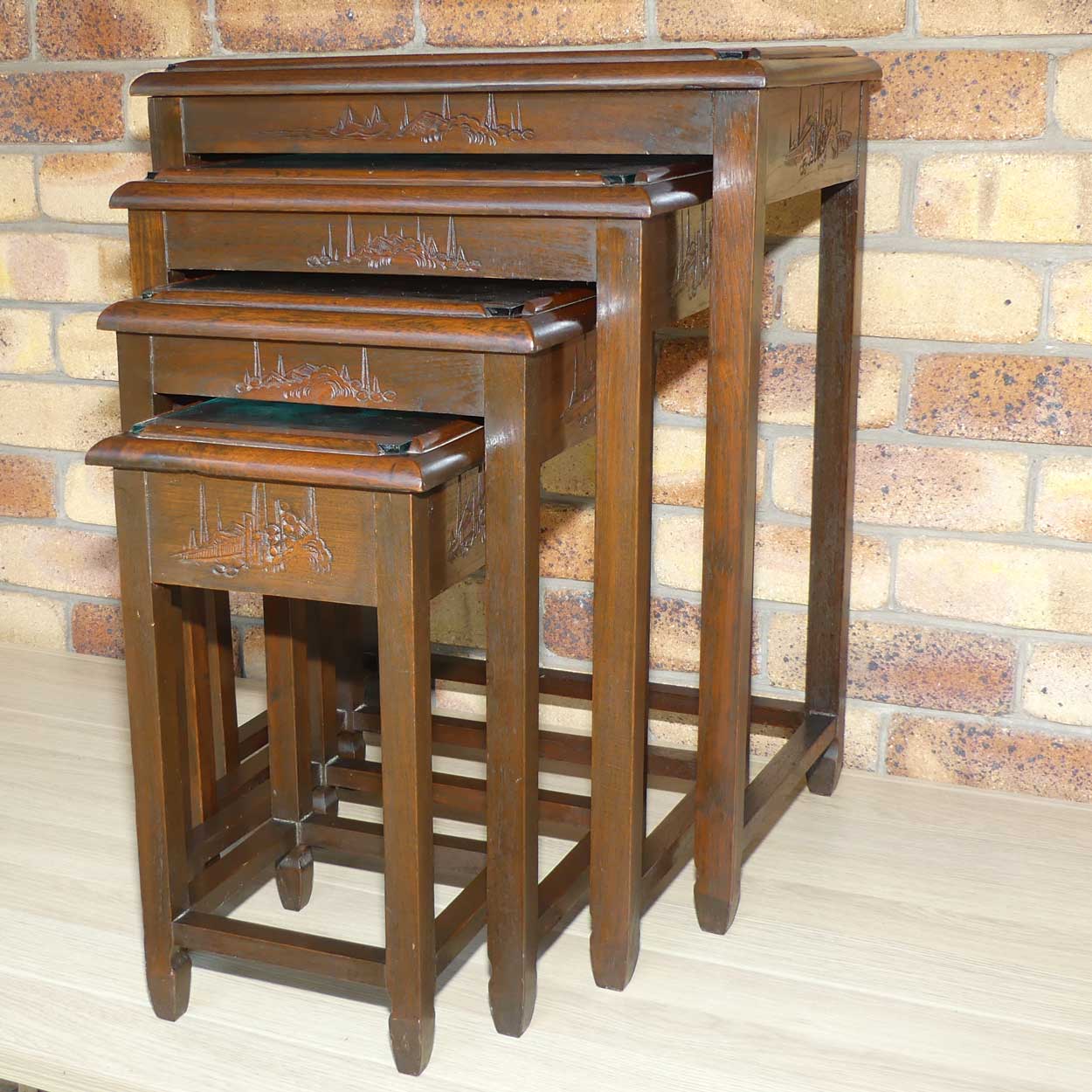 Chinese Carved Nest of 4 Occasional tables with Glass tops