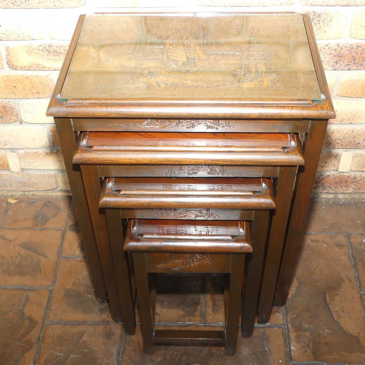 Chinese Carved Nest of 4 Occasional tables with Glass tops