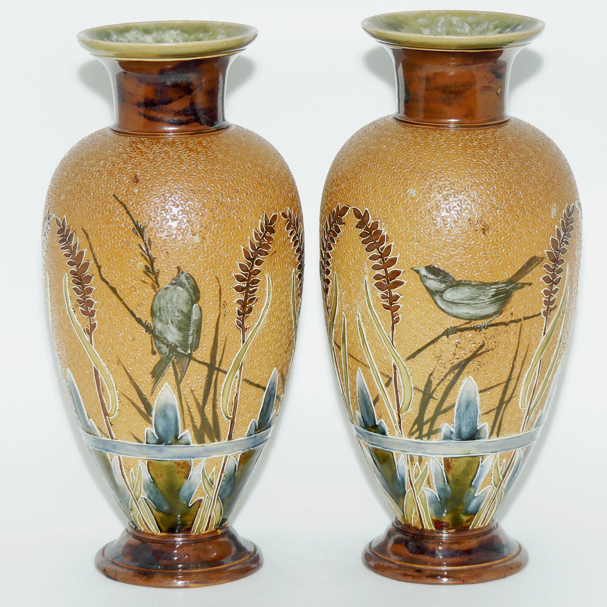 Doulton Lambeth Florence Barlow decorated pair of stoneware Vases featuring Birds amongst Ferns