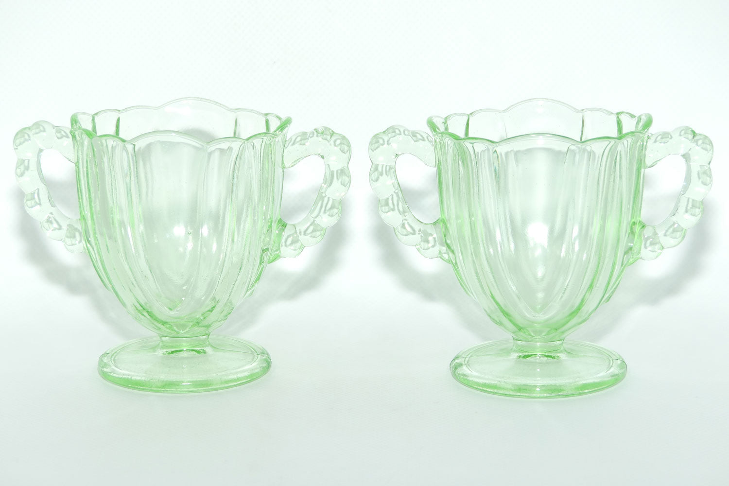 Pair of Ribbed handle Green Glass footed vases | 9.5cm tall
