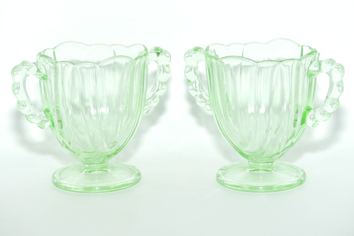 Pair of Ribbed handle Green Glass footed vases | 9.5cm tall