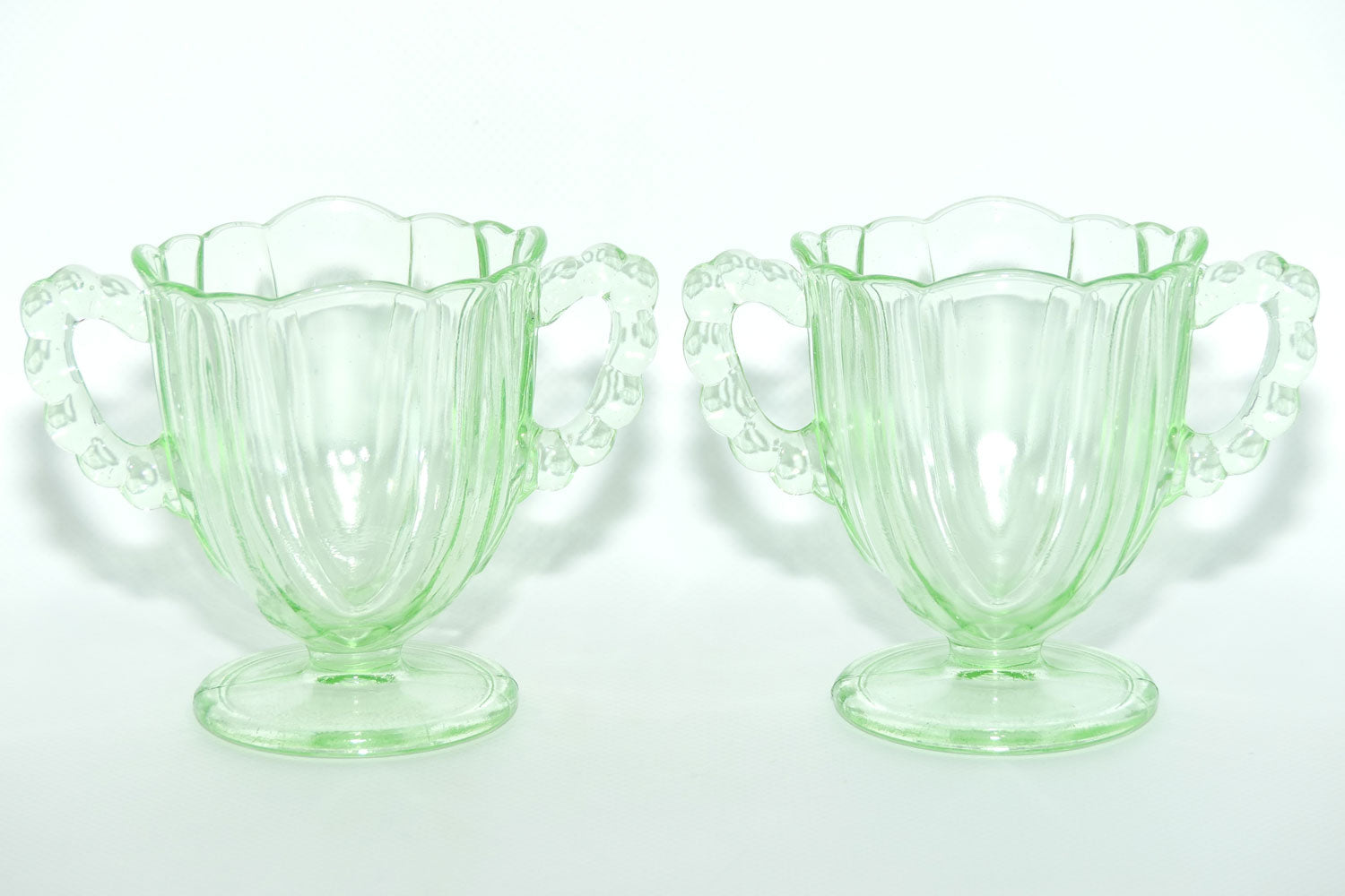 Pair of Ribbed handle Green Glass footed vases | 9.5cm tall