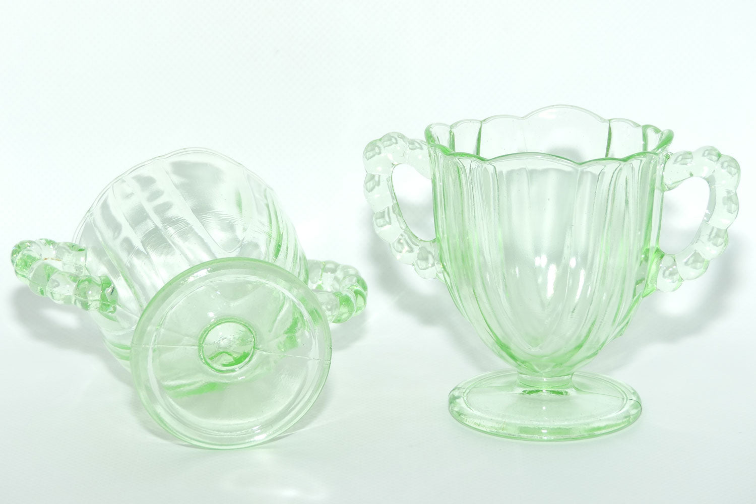 Pair of Ribbed handle Green Glass footed vases | 9.5cm tall