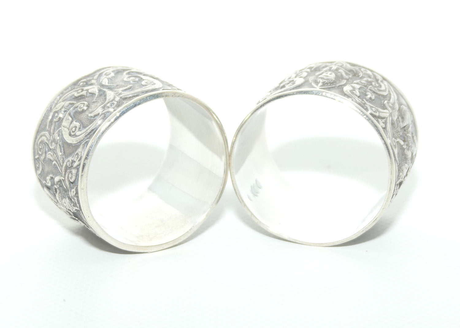 Pair of Heavily Embossed Siam Sterling Silver napkin or serviette rings | 52.15g the pair