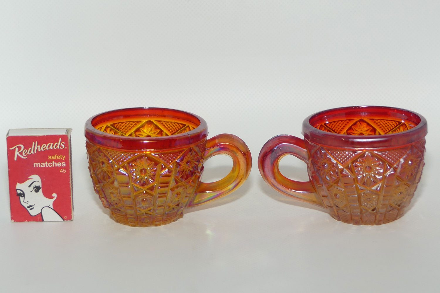 Pair of Indiana Carnival Glass cups | Red Amberina | Heirloom pattern