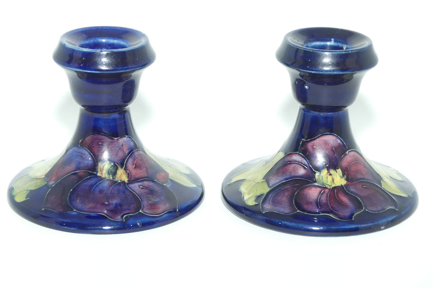 Walter Moorcroft Purple Clematis with Blue ground pair of candle holders