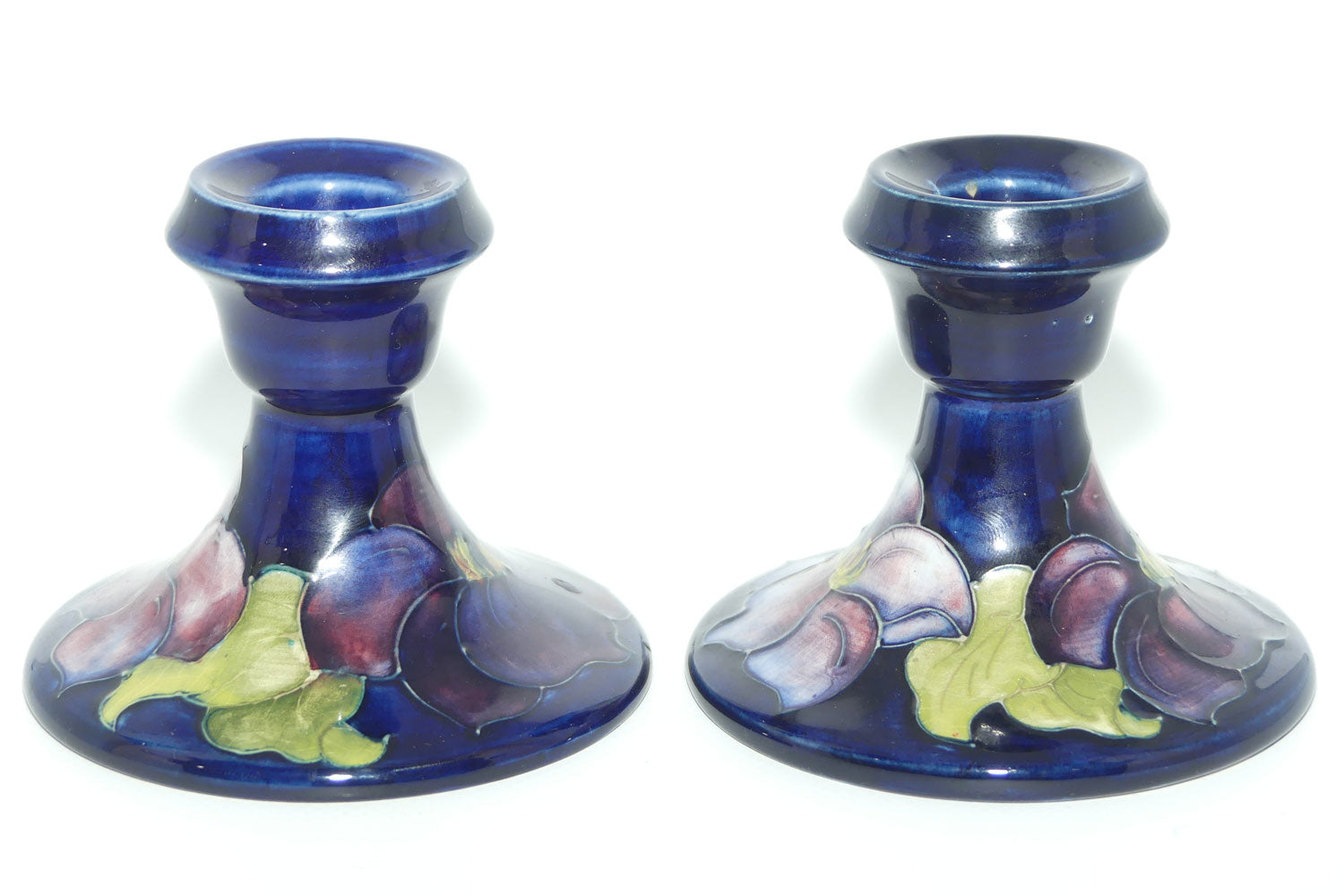 Walter Moorcroft Purple Clematis with Blue ground pair of candle holders