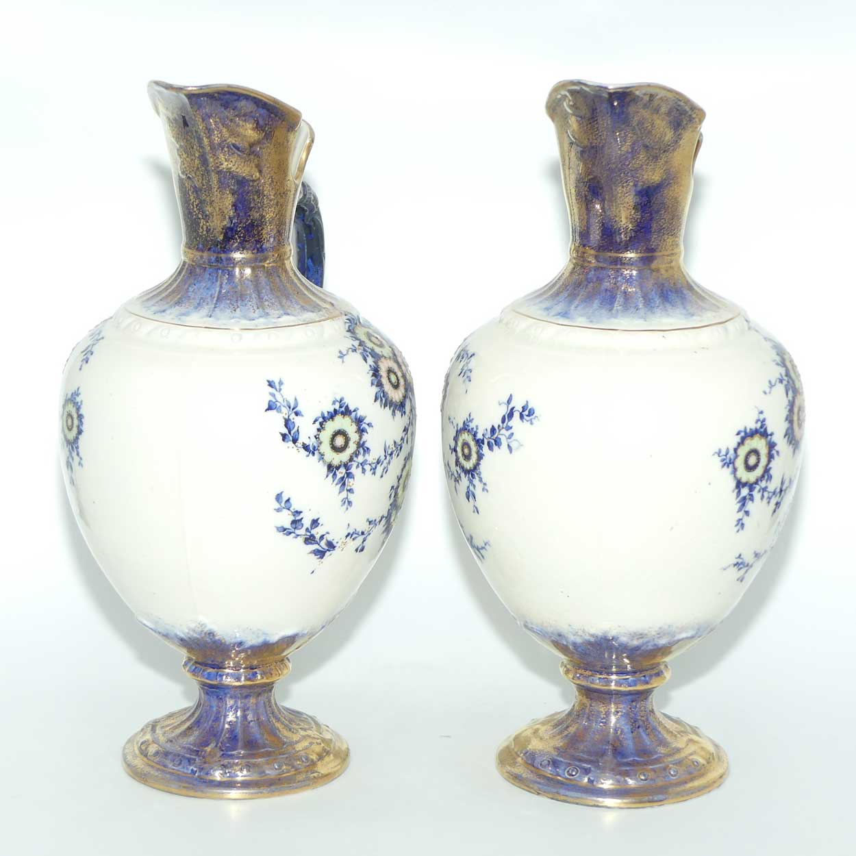 Pair of Flow Blue and Gilt Staffordshire floral decorated ewers