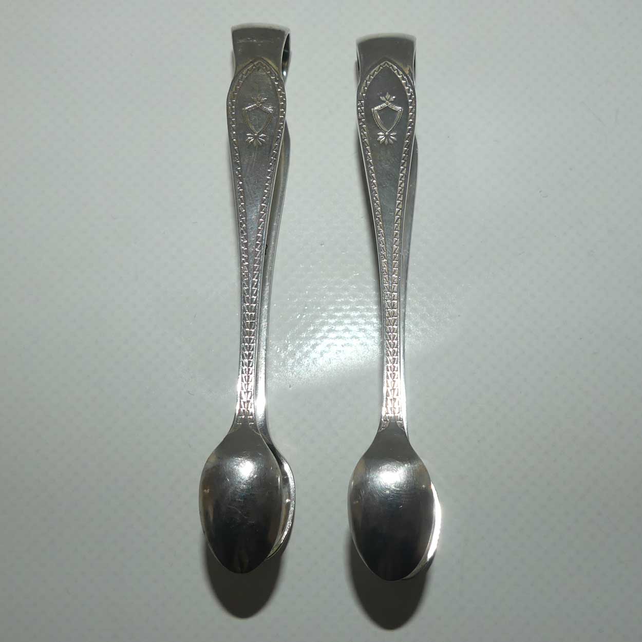 Matched Pair of Walker Hall & Sons silver plated sugar tongs