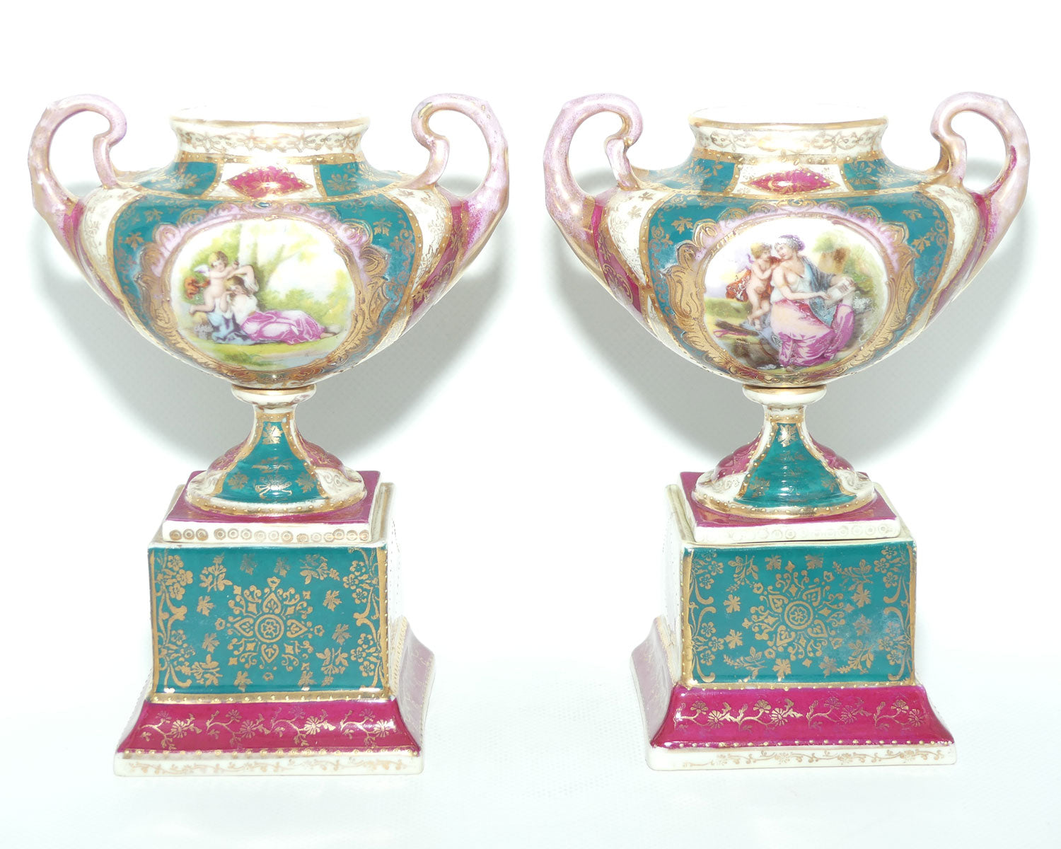 Royal Vienna pair of smaller twin handle cabinet vases on plinths