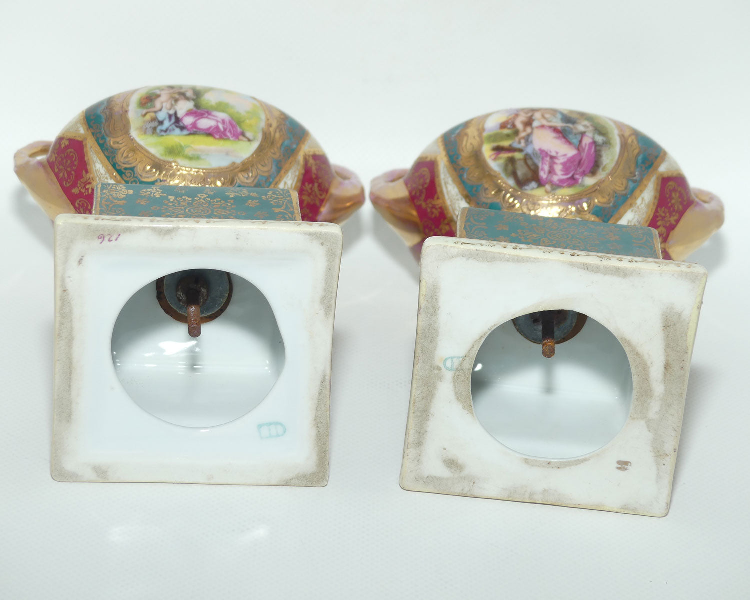 Royal Vienna pair of smaller twin handle cabinet vases on plinths