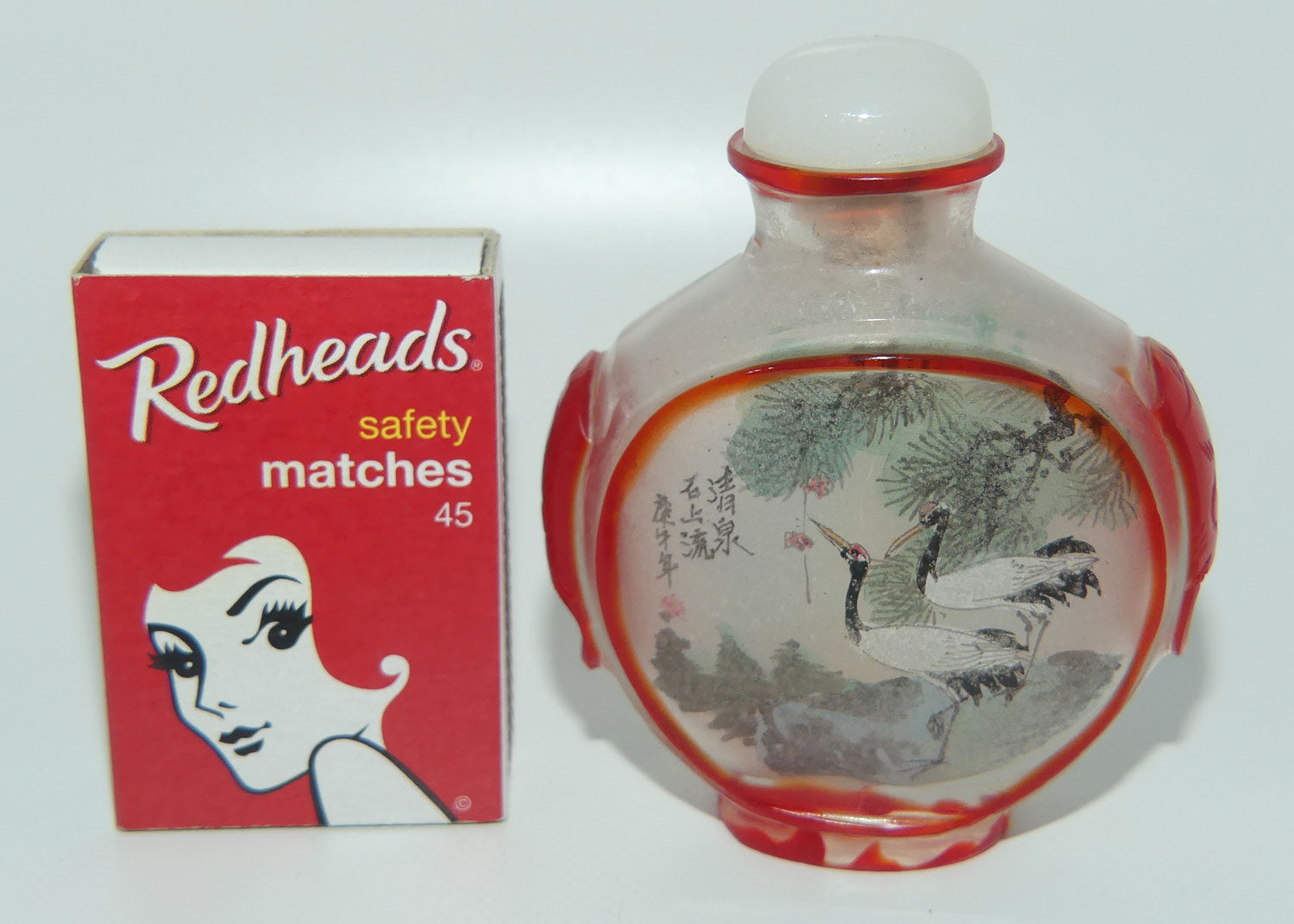 Peking Glass Red and Clear Reverse Painted double scene Snuff Bottle