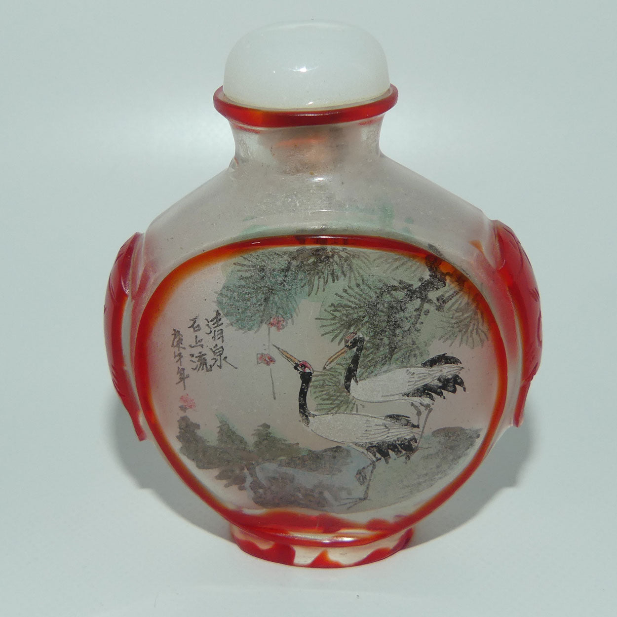 Peking Glass Red and Clear Reverse Painted double scene Snuff Bottle