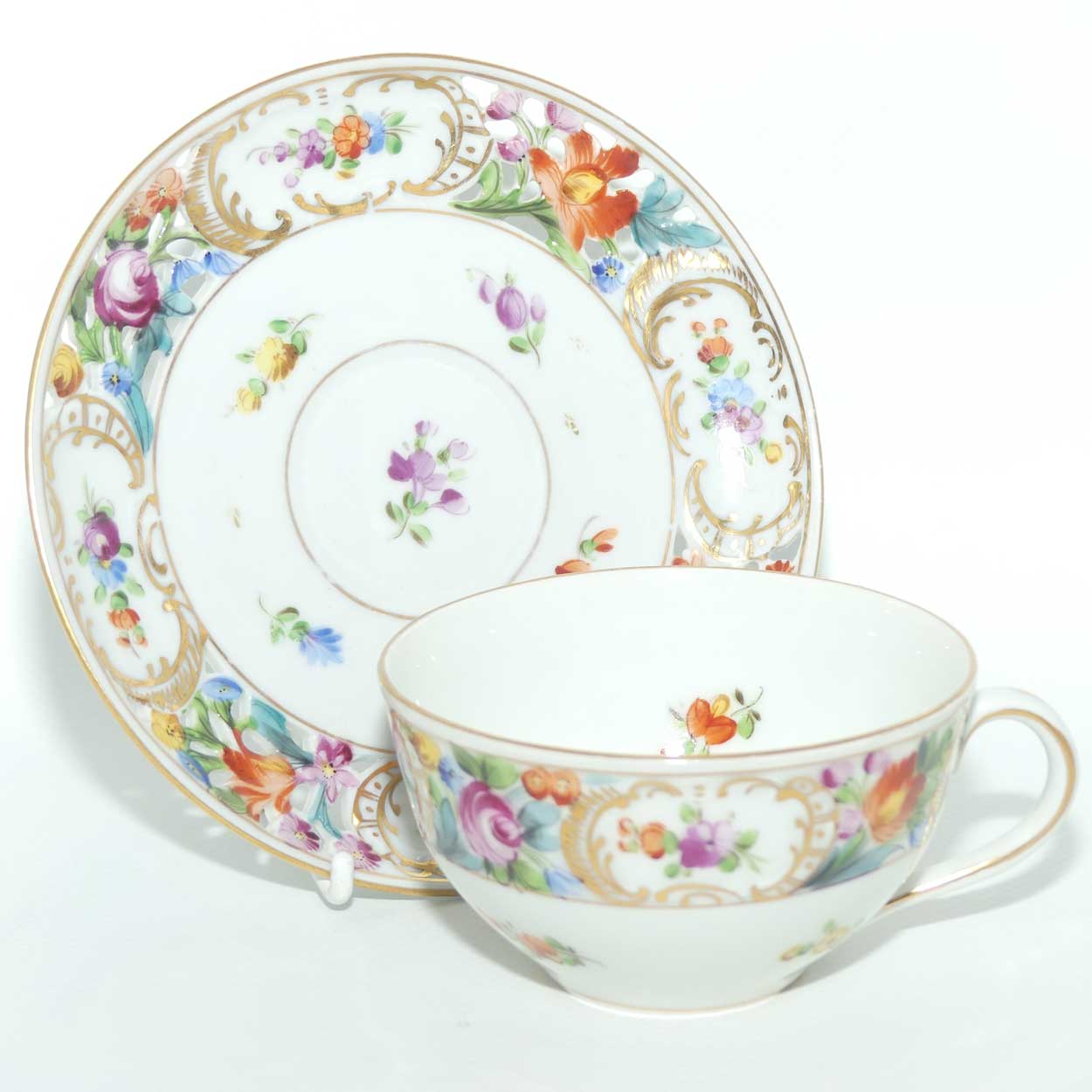 Exquisite pierced gallery Dresden floral cup and saucer