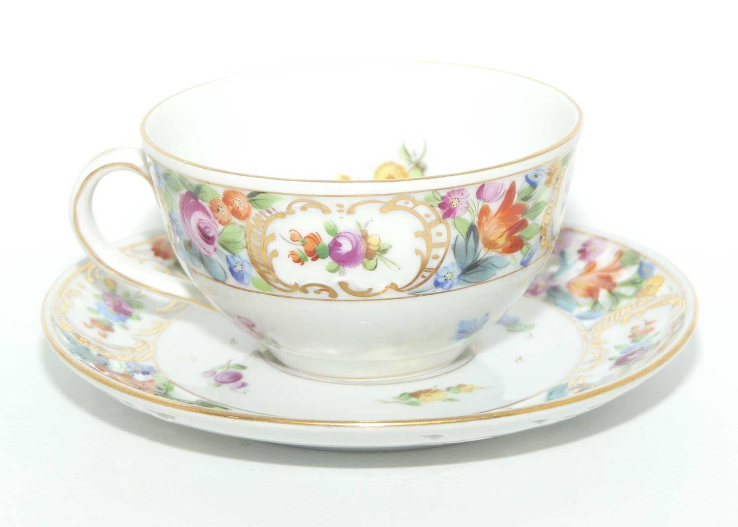 Exquisite pierced gallery Dresden floral cup and saucer