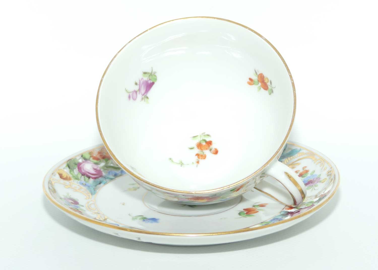 Exquisite pierced gallery Dresden floral cup and saucer