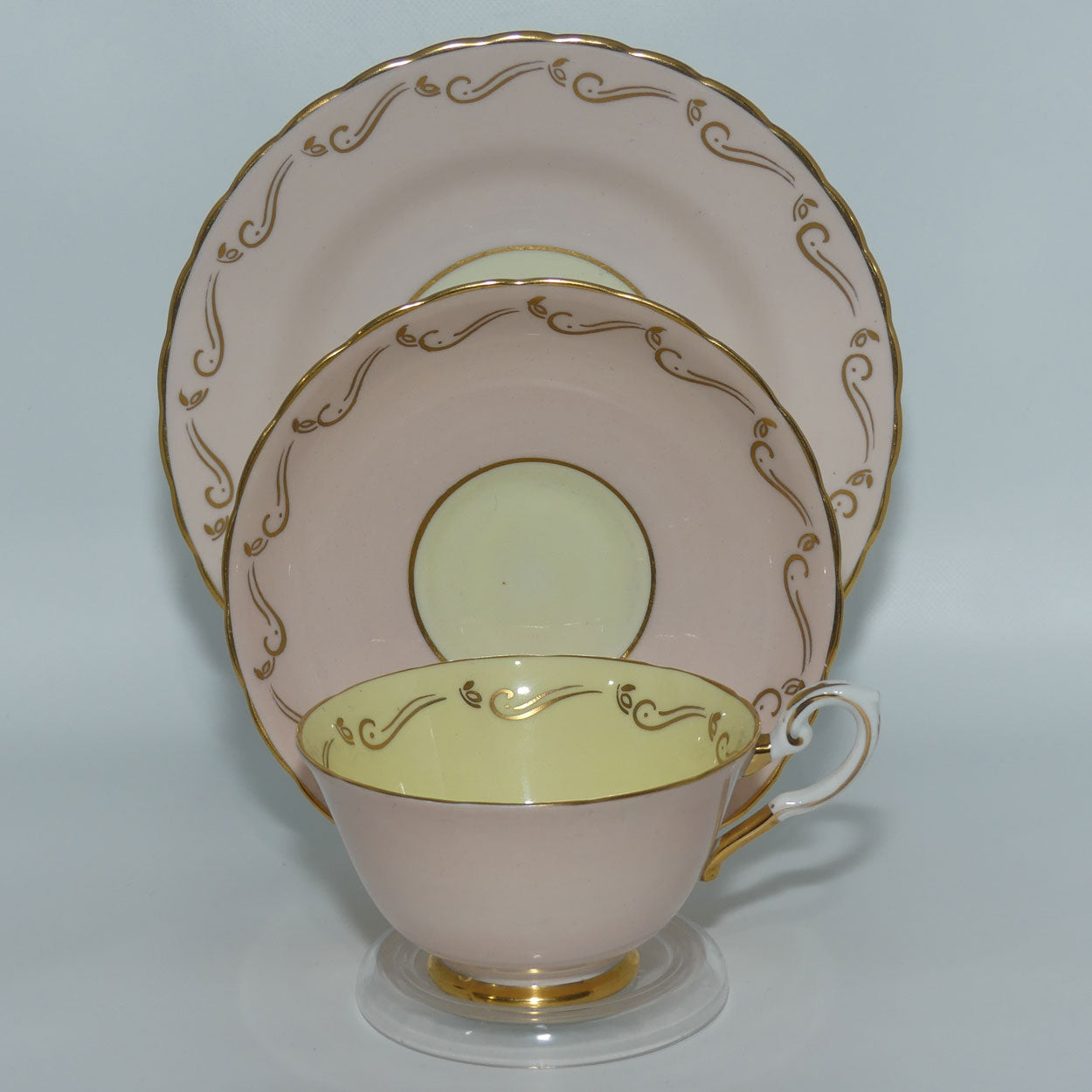 Tuscan Fine English Bone China Pink and Gilt Swirl trio | Fancy handle | Yellow Interior
