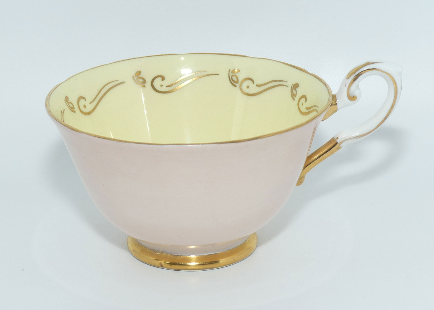 Tuscan Fine English Bone China Pink and Gilt Swirl trio | Fancy handle | Yellow Interior