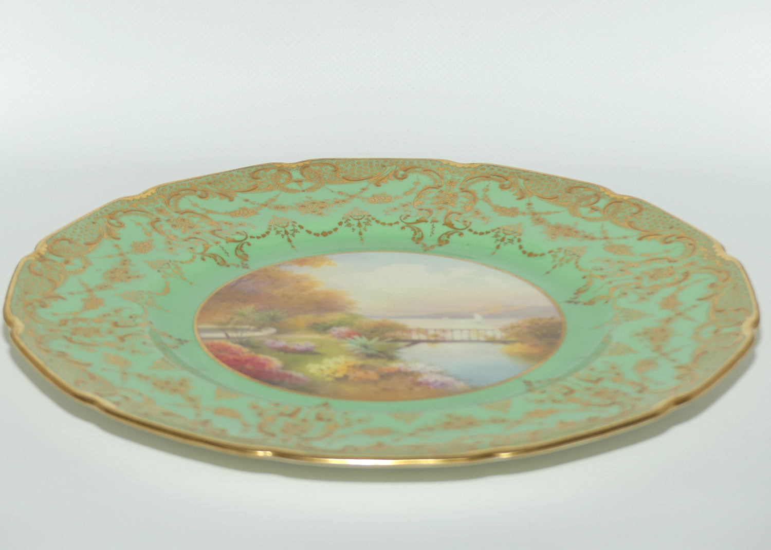 Royal Doulton hand painted and gilt Lake, Bridge & Garden plate (Price)