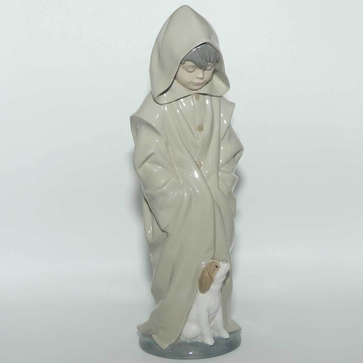 Nao figure Boy in Raincoat with Puppy Dog at Feet