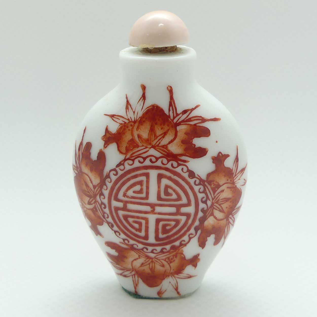 Chinese Red Floral pattern Snuff Bottle | Pink stone stopper
