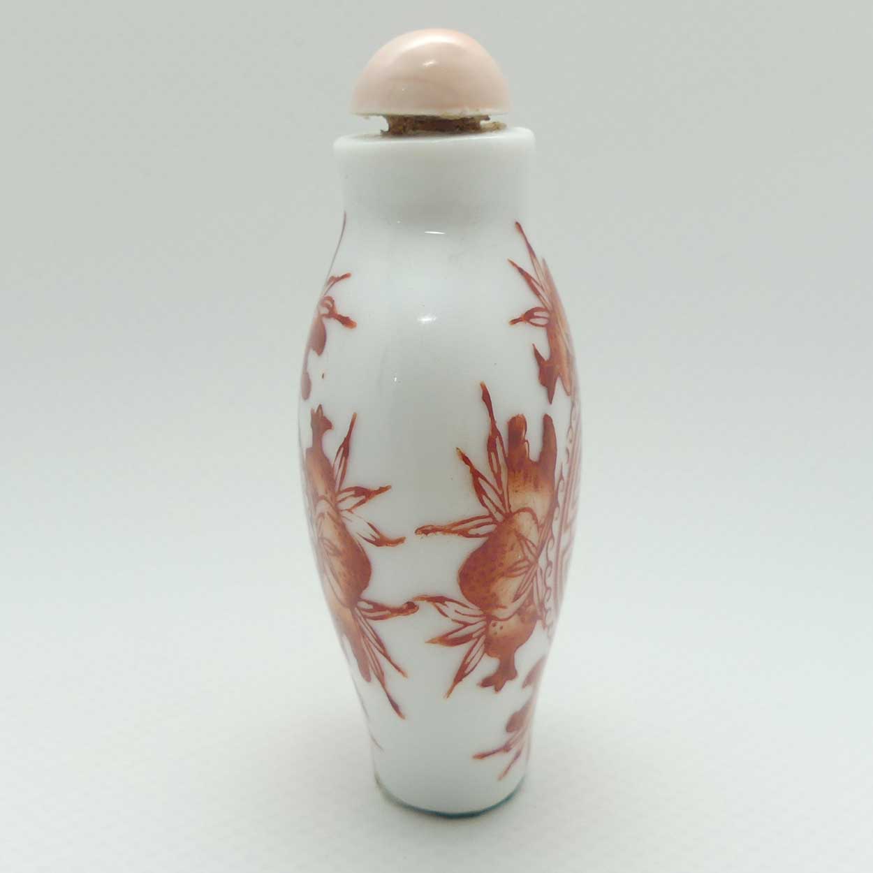 Chinese Red Floral pattern Snuff Bottle | Pink stone stopper