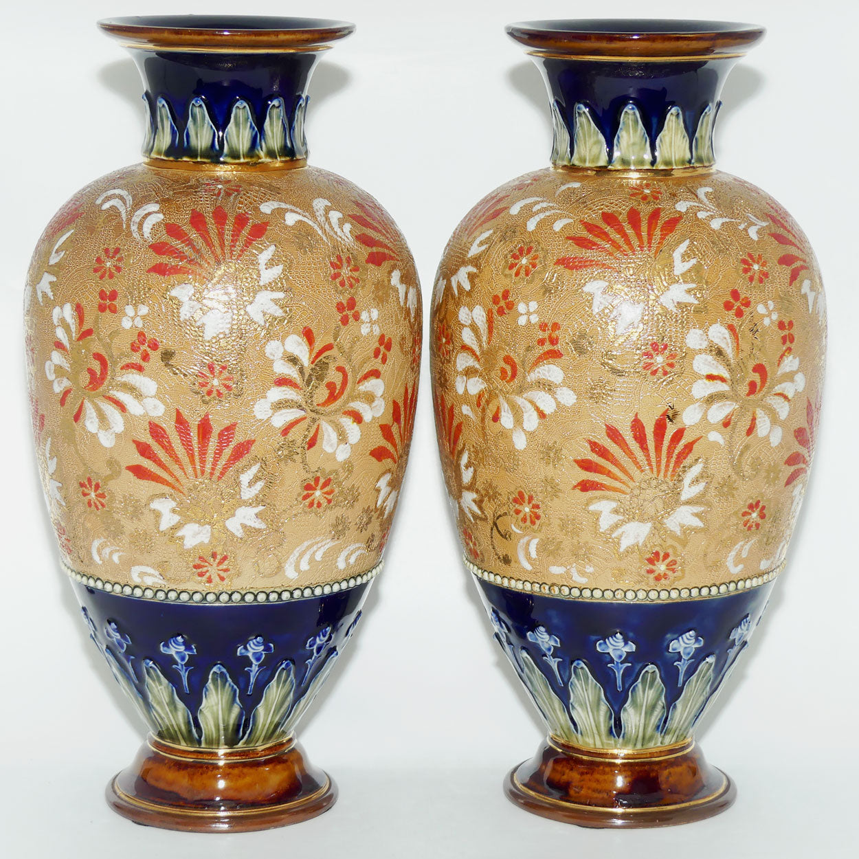 Royal Doulton stoneware pair of bulbous vases with red & white enamelled flowers, gilt highlights, applied leaves & dots (stamped 4461)