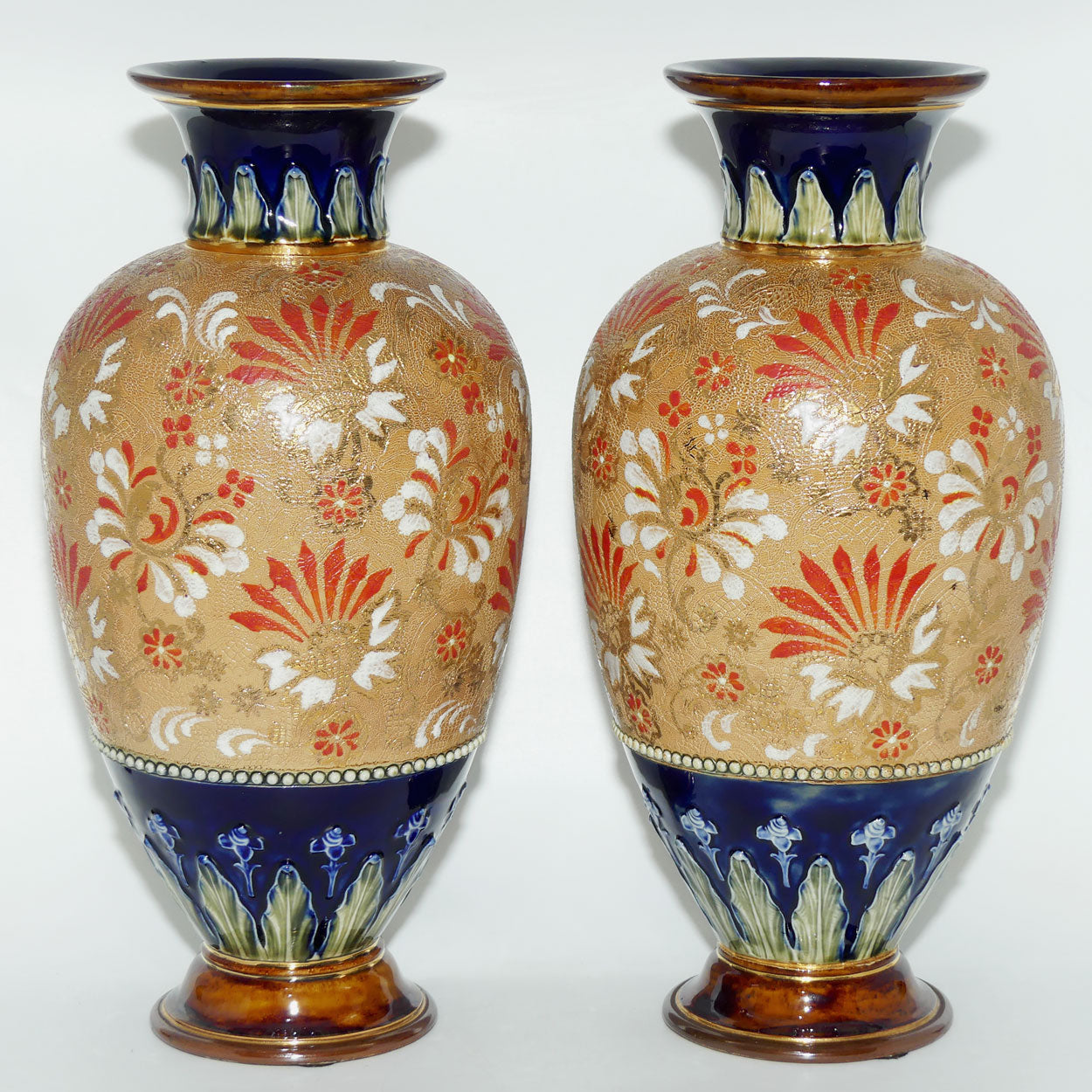 Royal Doulton stoneware pair of bulbous vases with red & white enamelled flowers, gilt highlights, applied leaves & dots (stamped 4461)