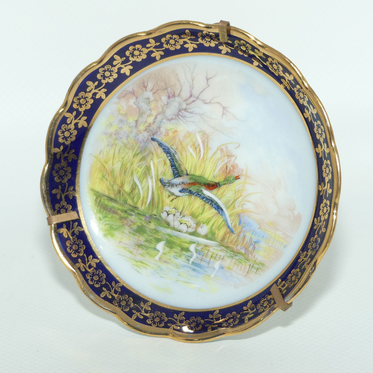 Rehausse Main Limoges France Blue and Gilt border Duck in Flight Scene plate | 9.5cm wide