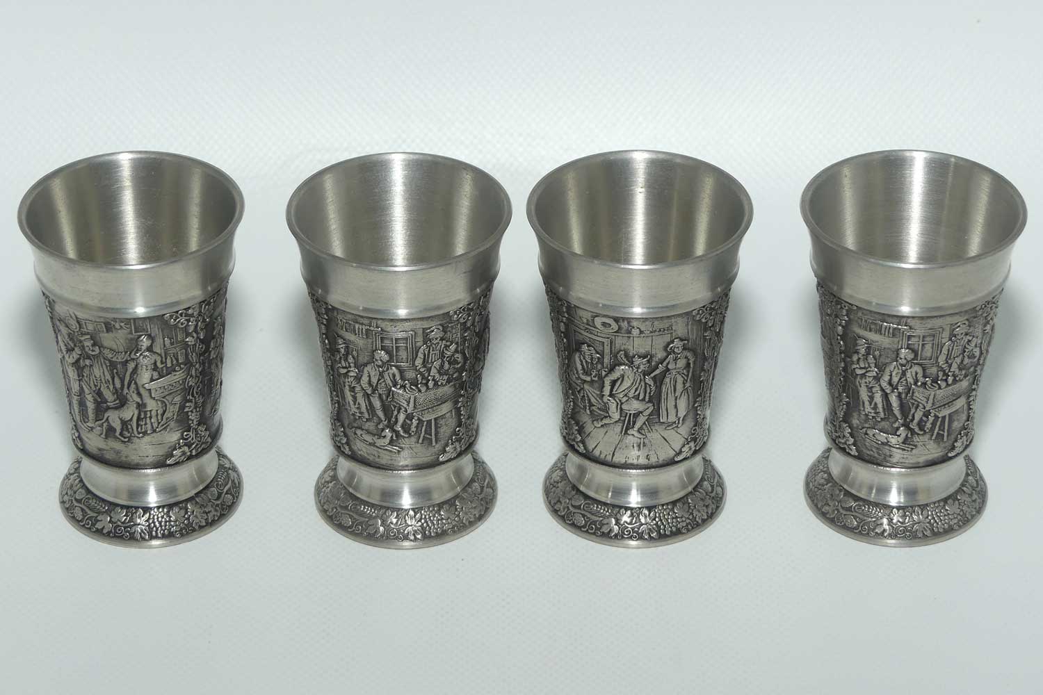 Set of 4 Creation Zinn Pewter well figured shot glasses
