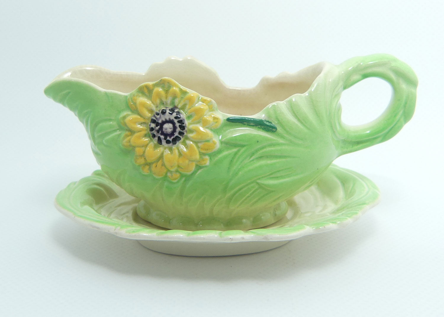 Shorter and Son Staffordshire Floral embossed mayonnaise jug and saucer