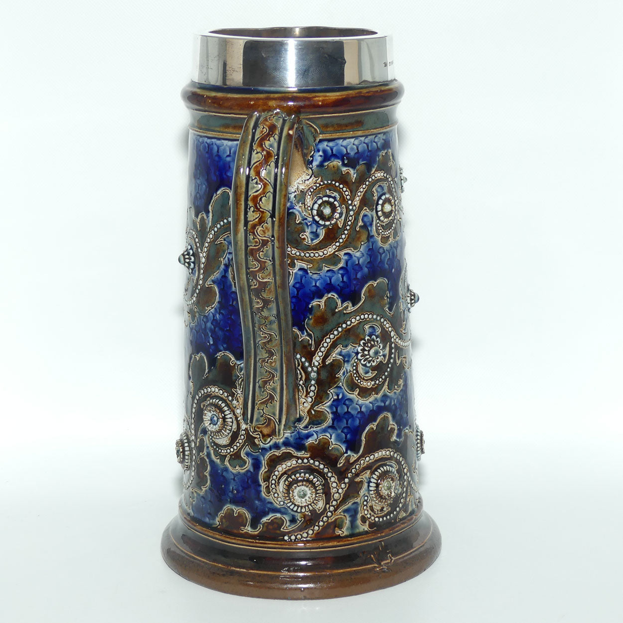 Doulton Lambeth George Tinworth stoneware ale jug with Sterling Silver rim (London 1876)