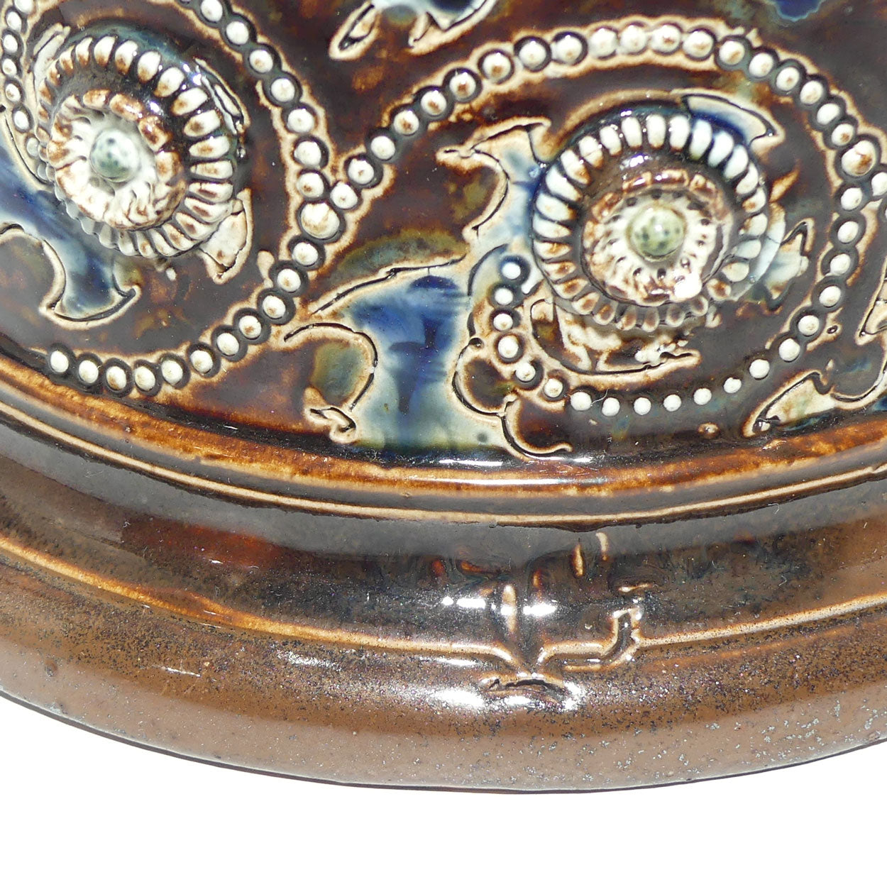 Doulton Lambeth George Tinworth stoneware ale jug with Sterling Silver rim (London 1876)