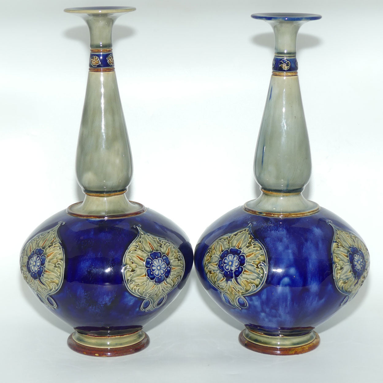 Royal Doulton stoneware pair of tall bulbous vases with applied floral rosettes
