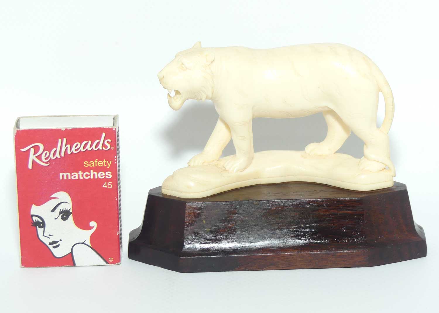 Carved Ivory figure of Tiger Stalking on Rosewood Base