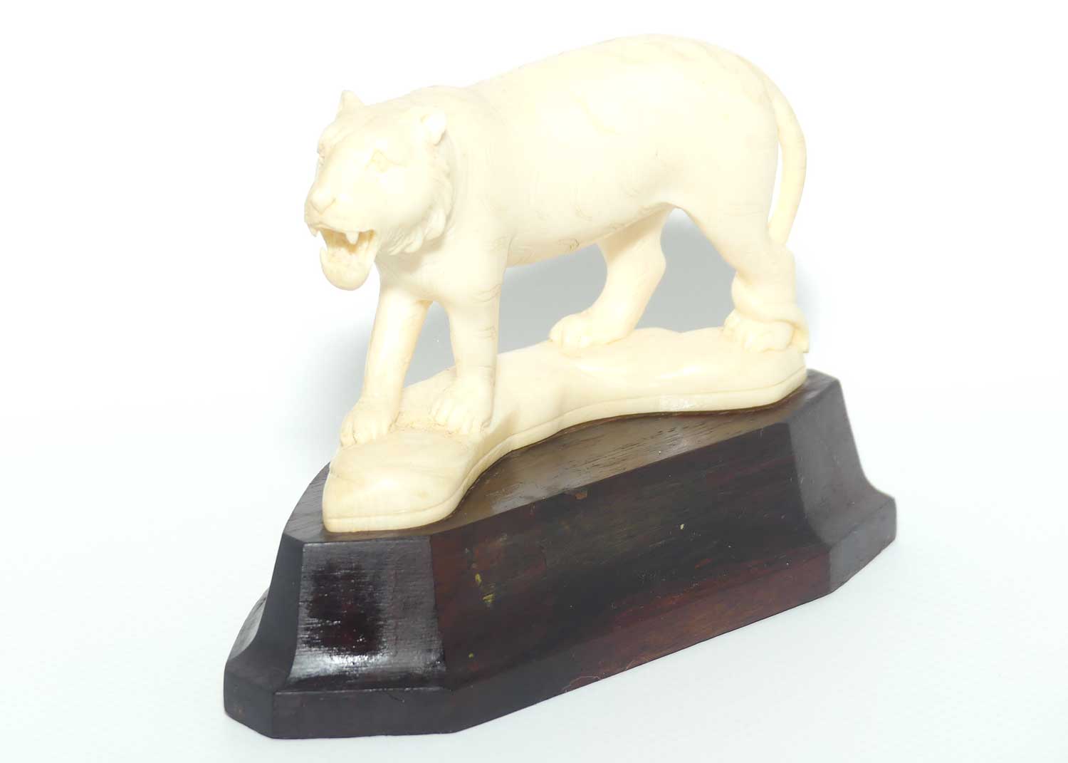 Carved Ivory figure of Tiger Stalking on Rosewood Base