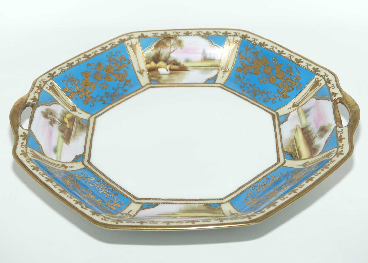 early Noritake Hand Painted and Gilt decorated Blue ground twin handle cake plate | Lake Scene