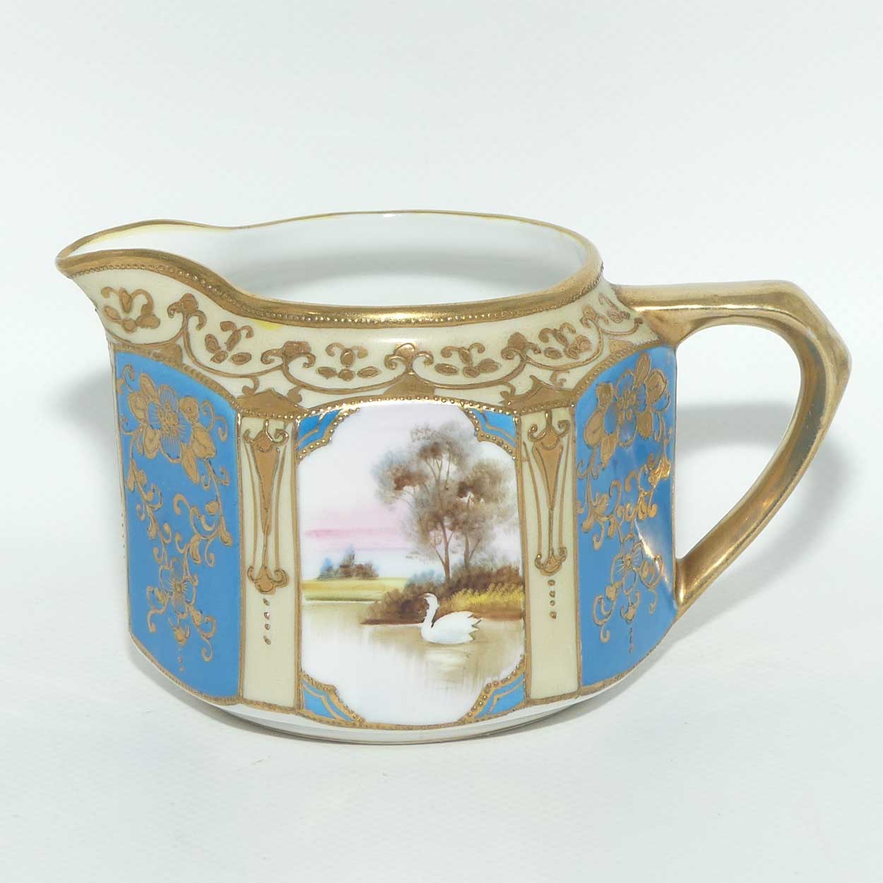 early Noritake Hand Painted and Gilt decorated Blue ground milk and sugar | Hexagonal shape | Lake Scene