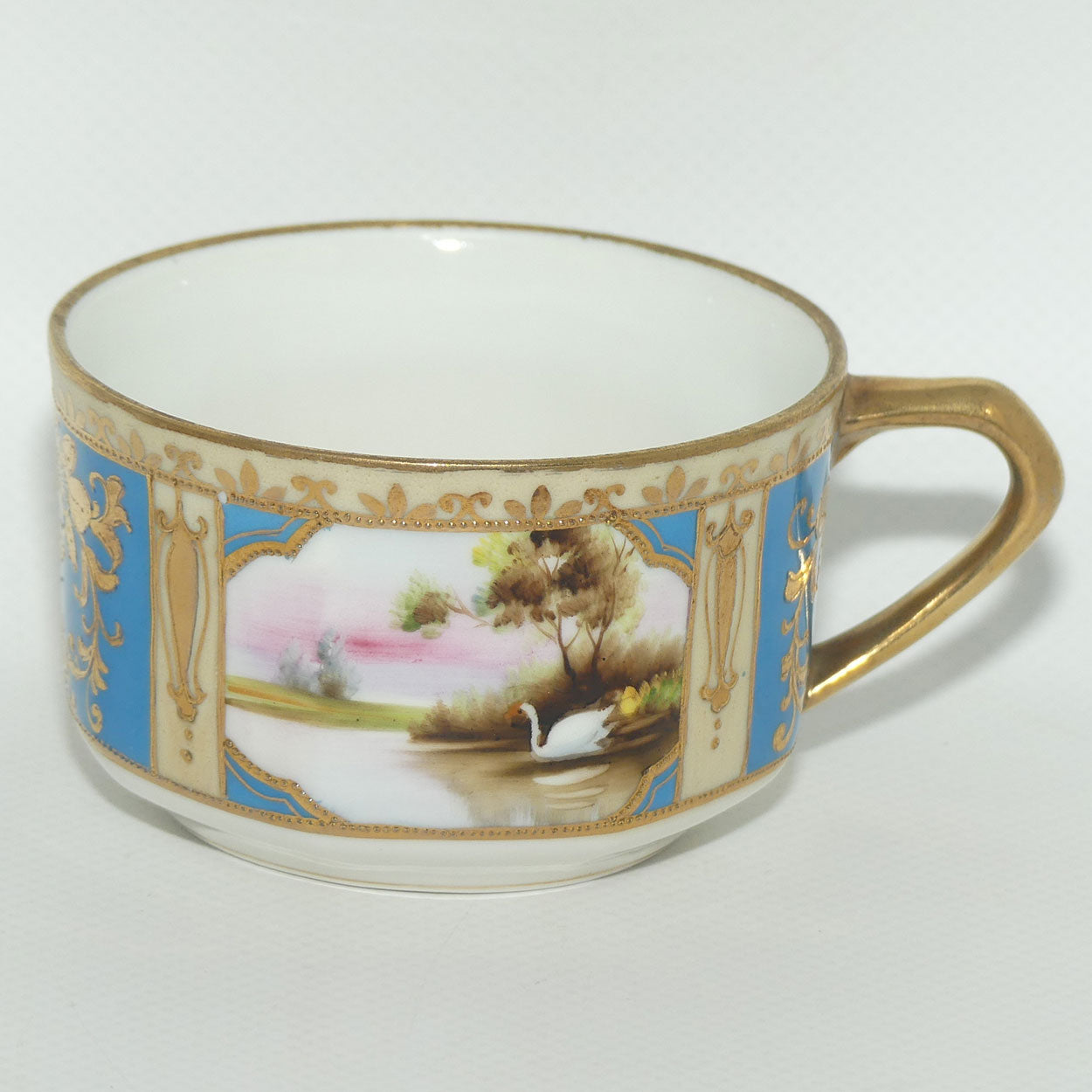 Early Noritake Hand Painted and Gilt decorated Blue ground tea trio | #1 | Lake Scene