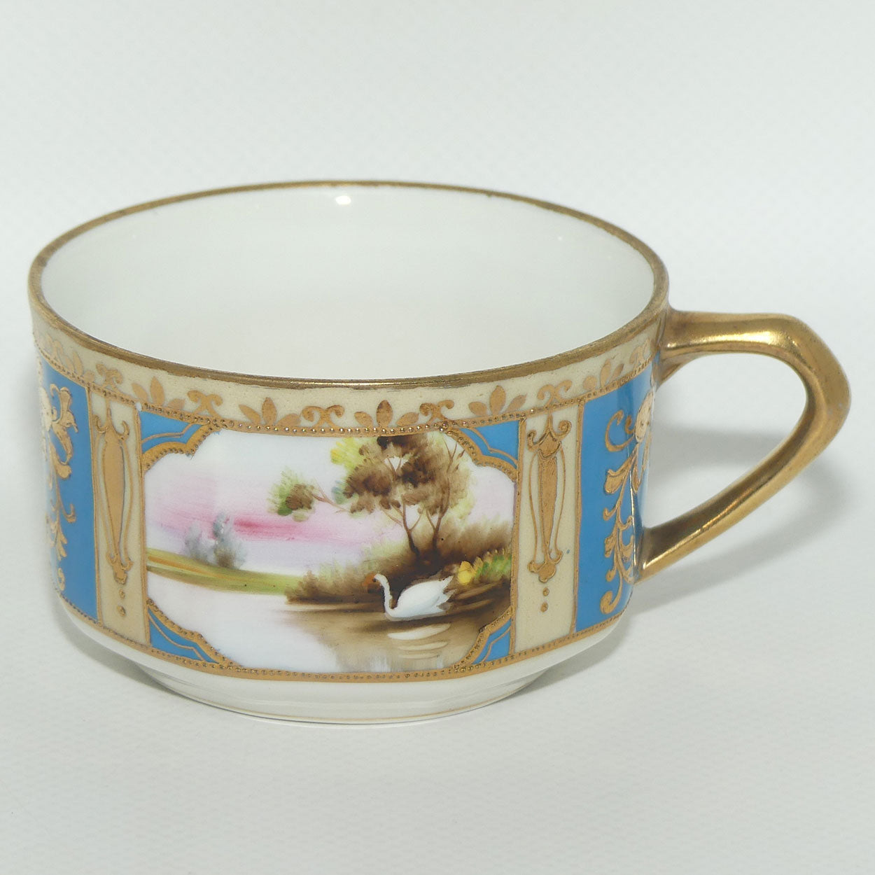 Early Noritake Hand Painted and Gilt decorated Blue ground tea trio | #1 | Lake Scene