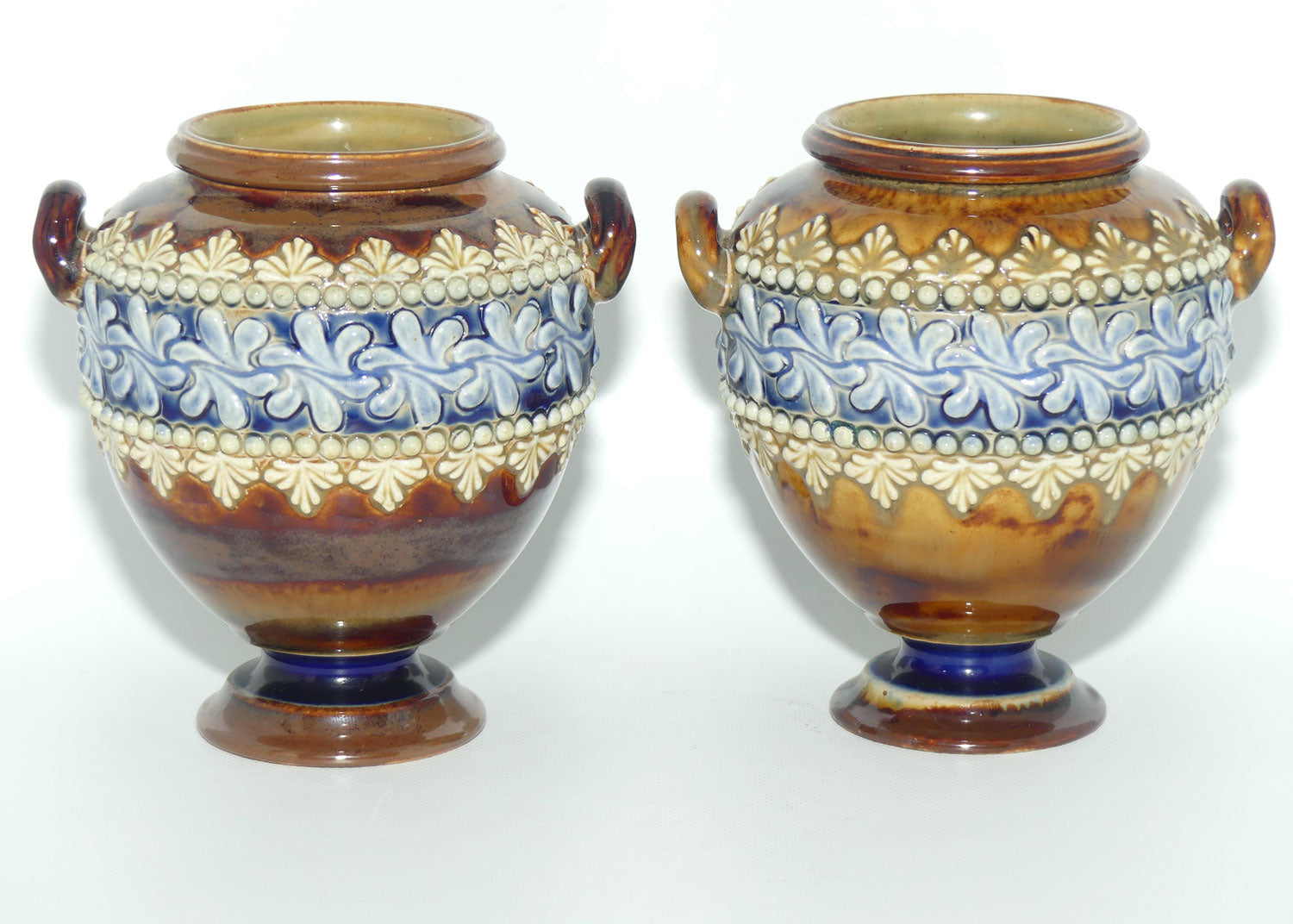 Doulton Lambeth stoneware pair of handled and footed urns (#4505)